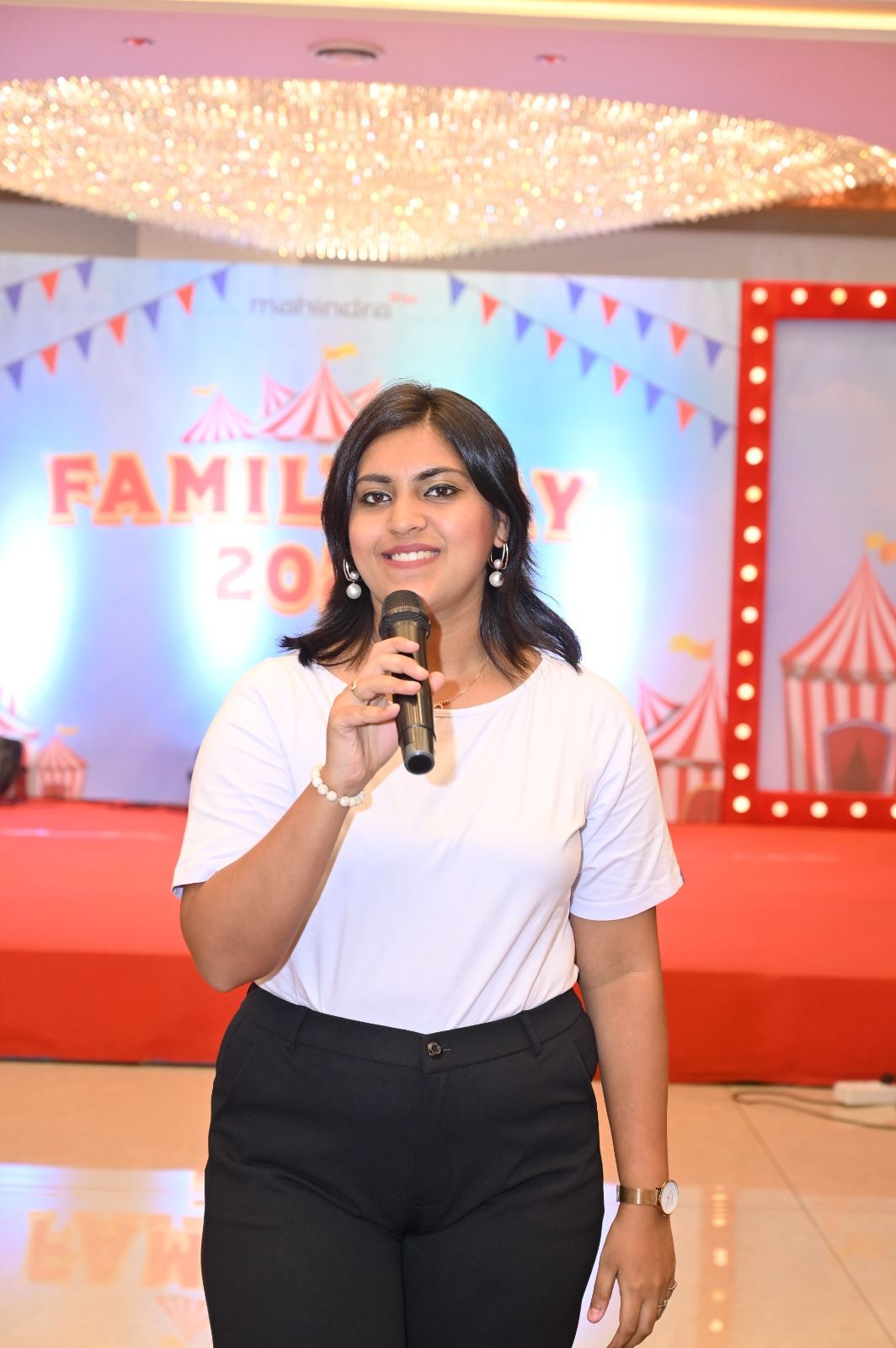 Anchor Ananya Kundu hosting a corporate family day