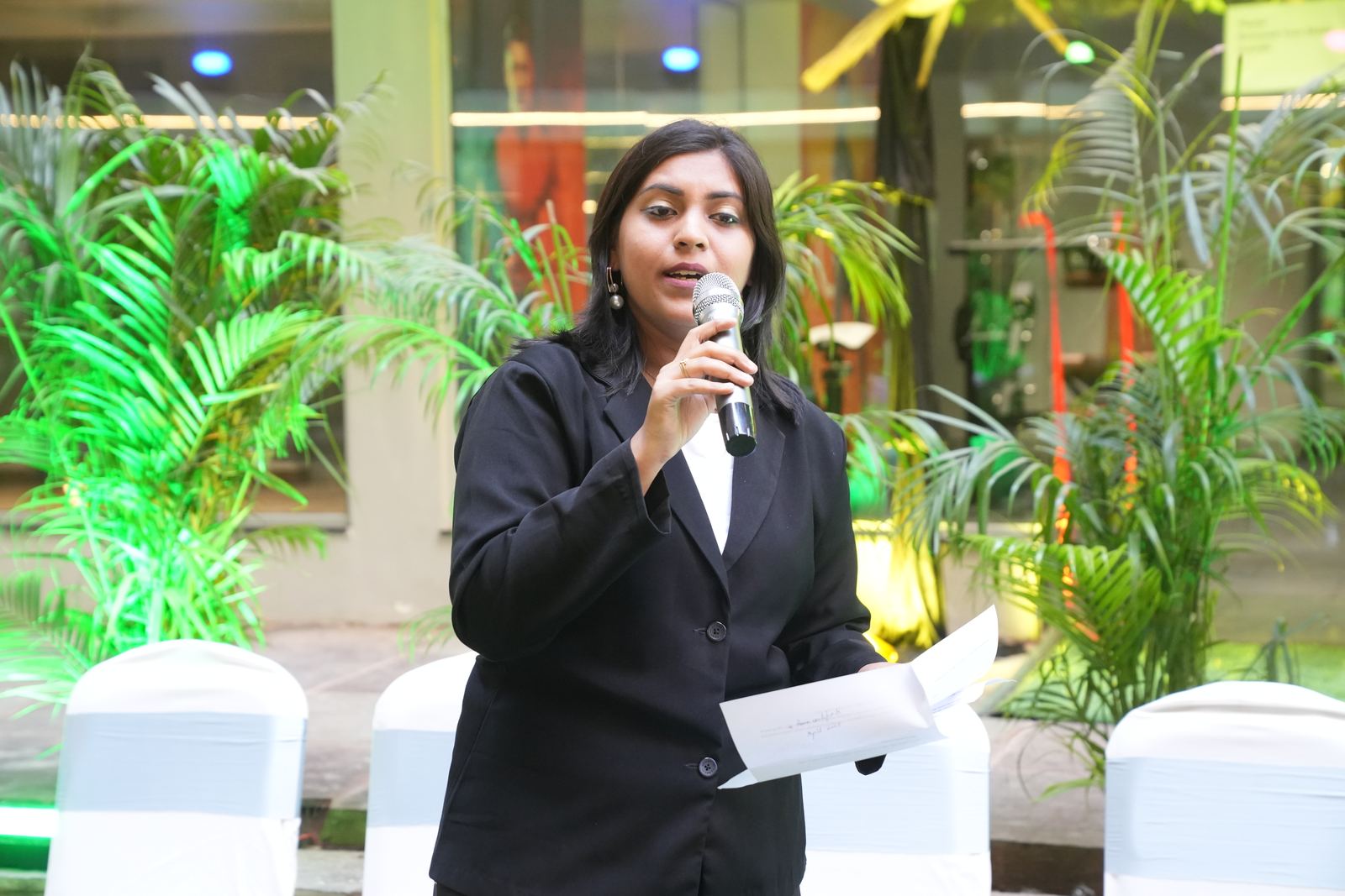 Anchor Ananya Kundu engaging a corporate audience