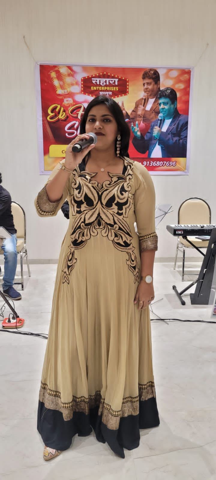 Anchor Ananya Kundu hosting a festival night programme