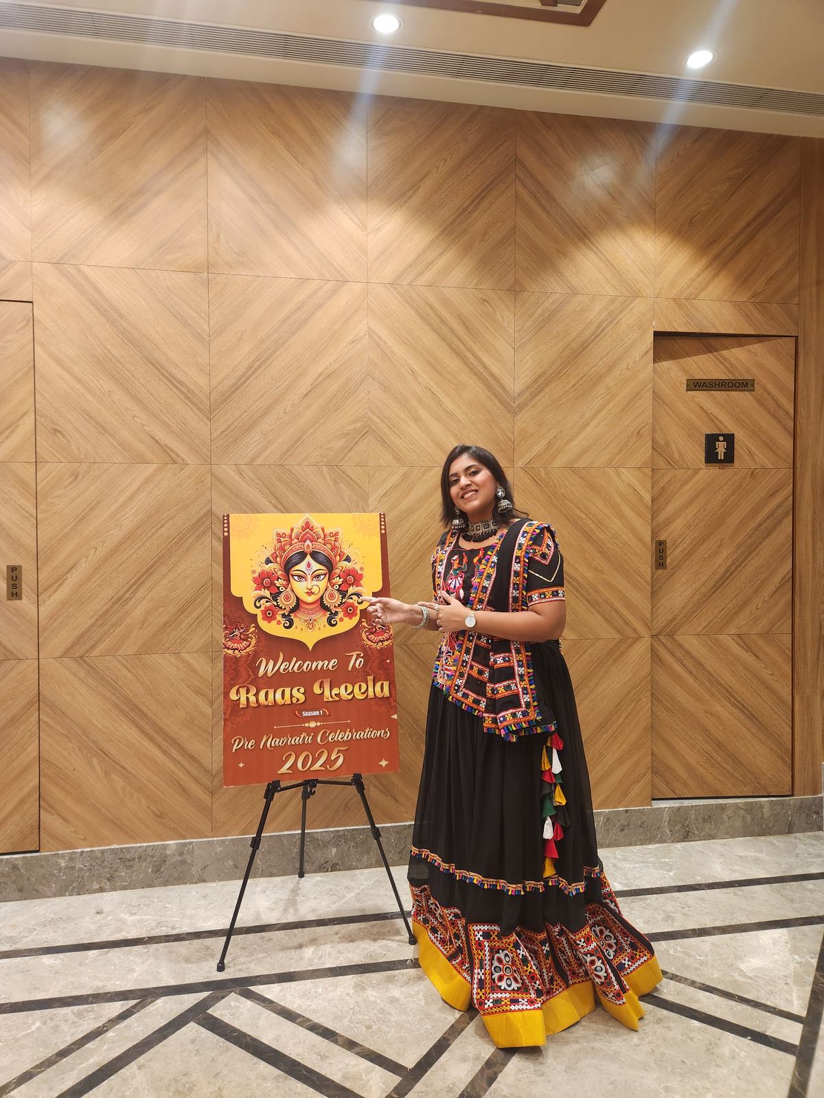 Anchor Ananya Kundu hosting a cultural evening on stage