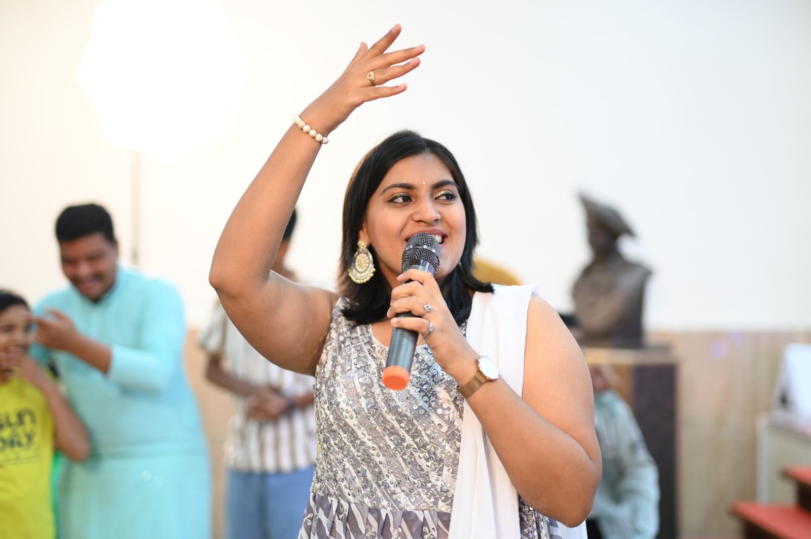 Anchor Ananya Kundu raising energy at a private party