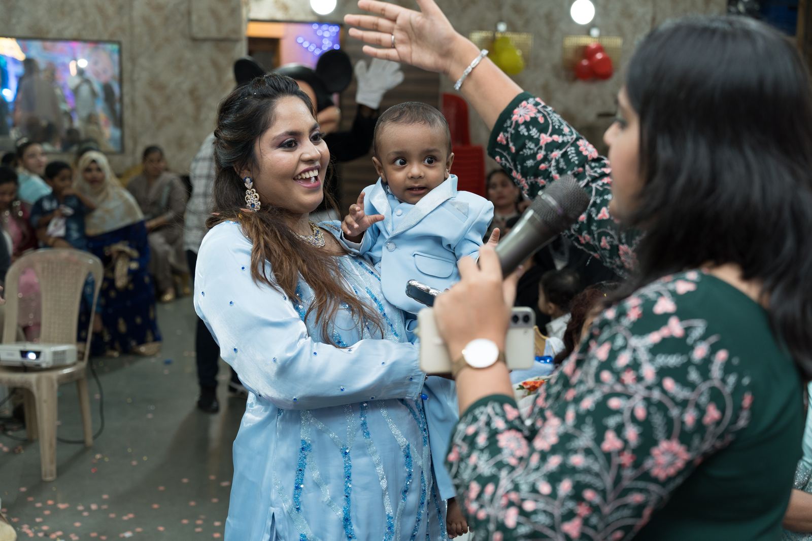 Anchor Ananya Kundu entertaining children at an event