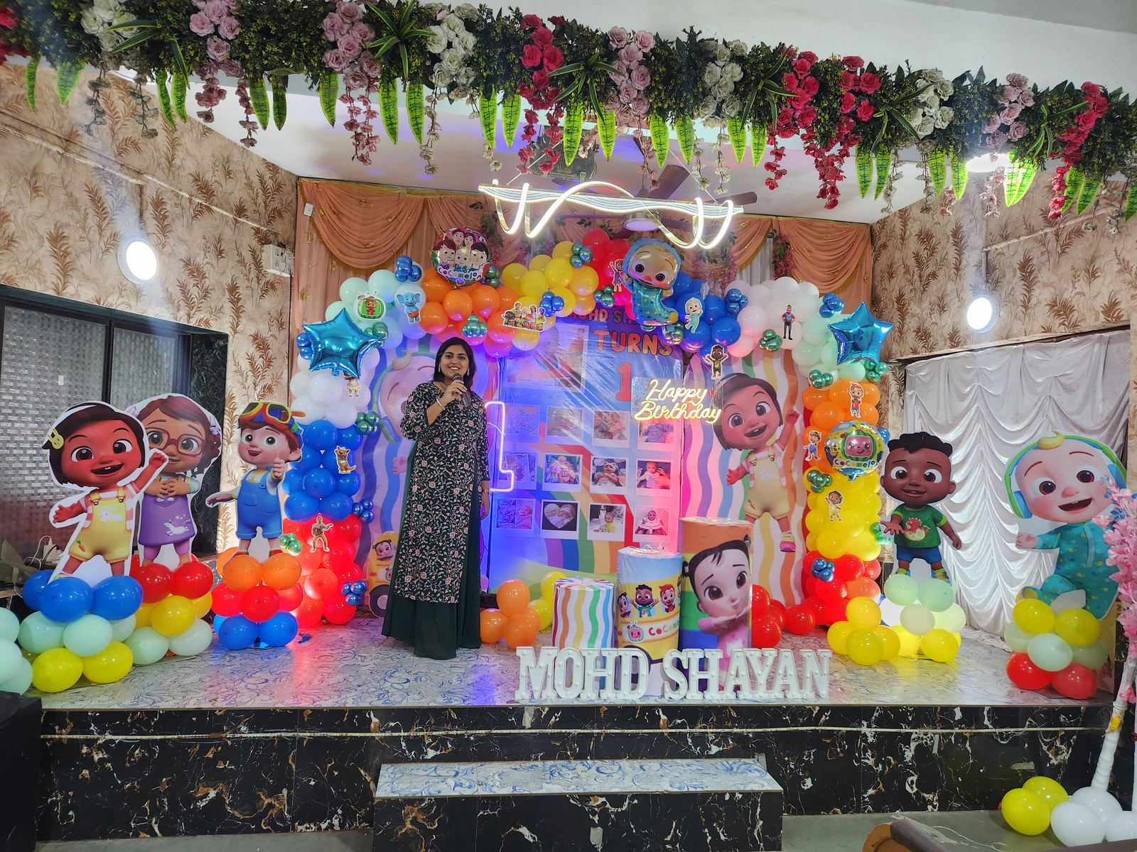 Anchor Ananya Kundu on a decorated celebration stage
