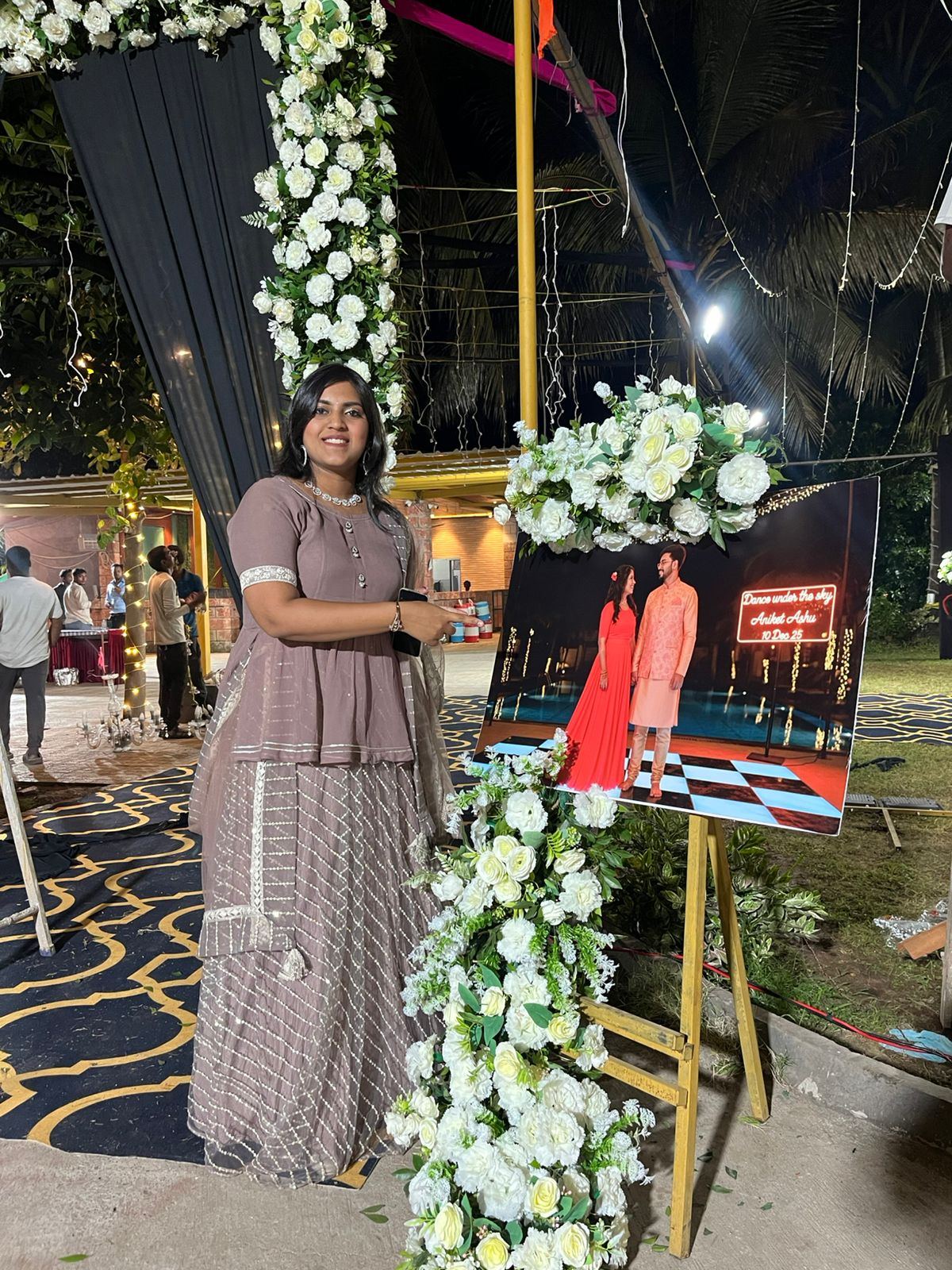 Anchor Ananya Kundu on a decorated sangeet stage