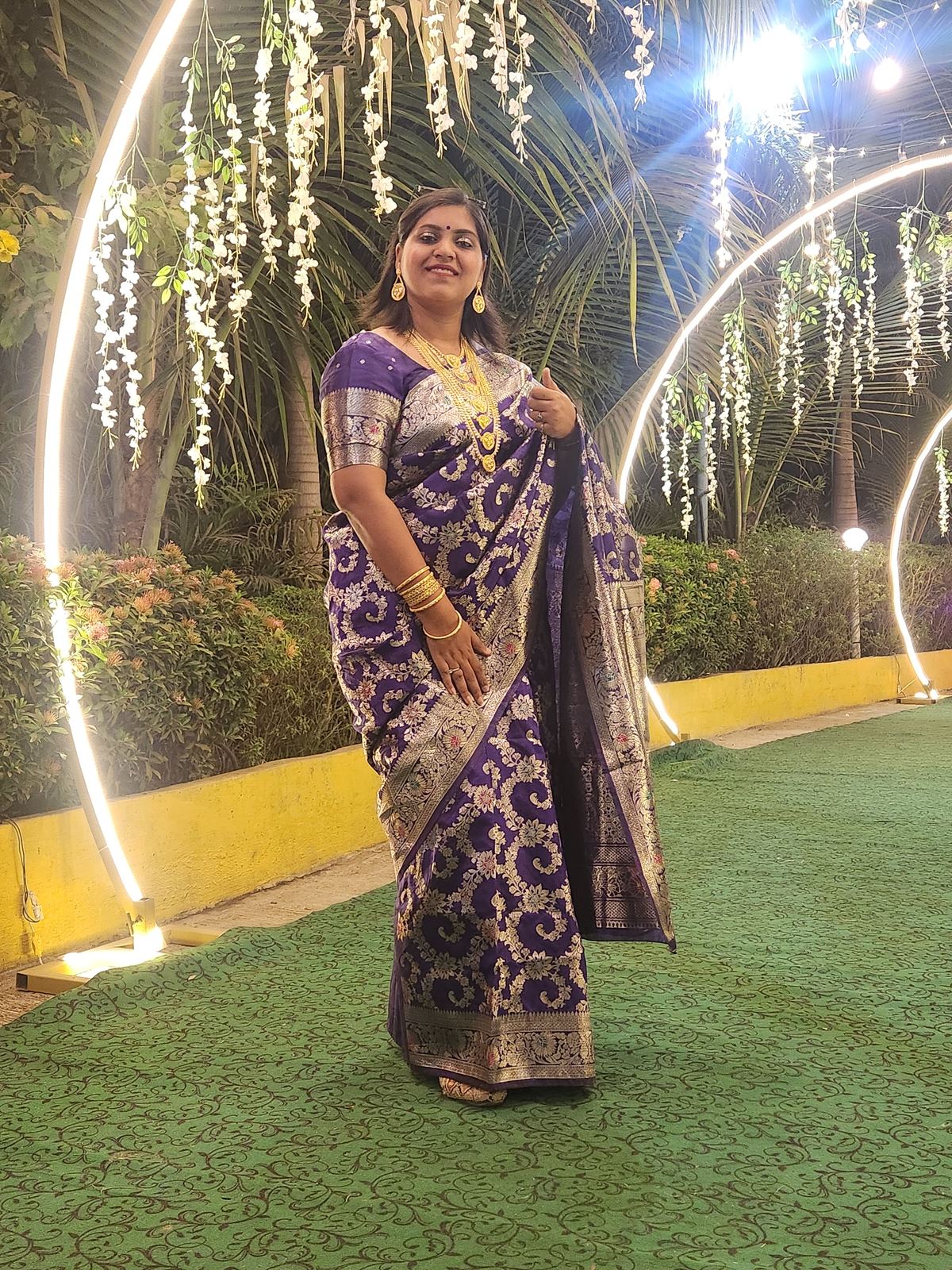 Anchor Ananya Kundu hosting an evening wedding ceremony