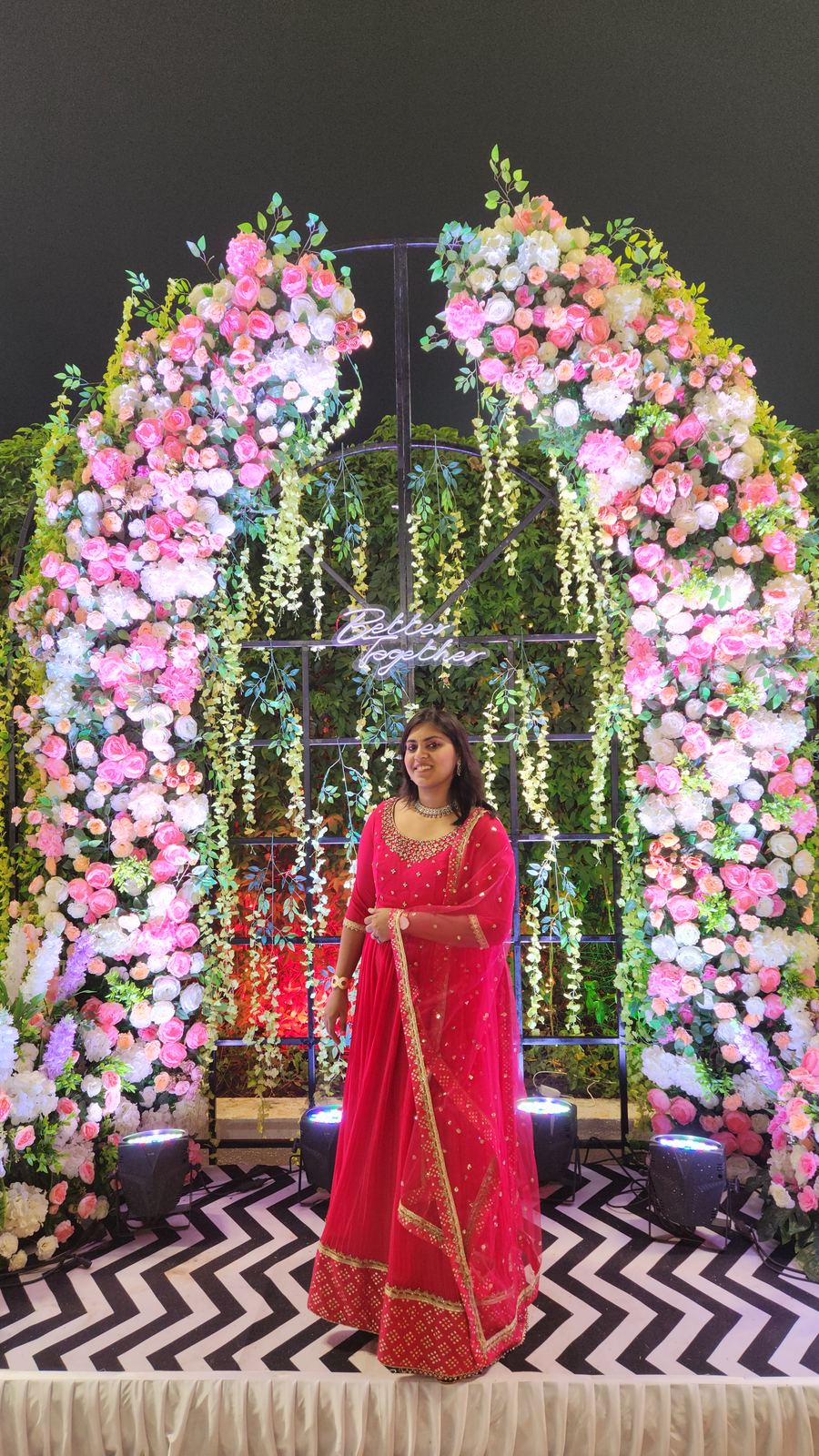 Anchor Ananya Kundu at a floral wedding reception stage